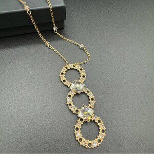 Belladonna Circular Crystal and Gold Tone Infinity Pendant Necklace